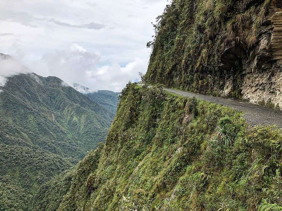 Death Road Bolivia narrow cliff road in Yungas mountains with lush green landscape