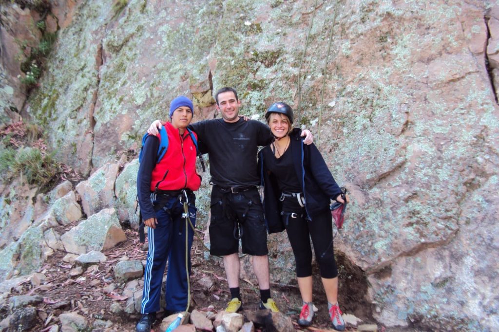 Climbers preparing for a guided rock climbing adventure near Sucre, Bolivia