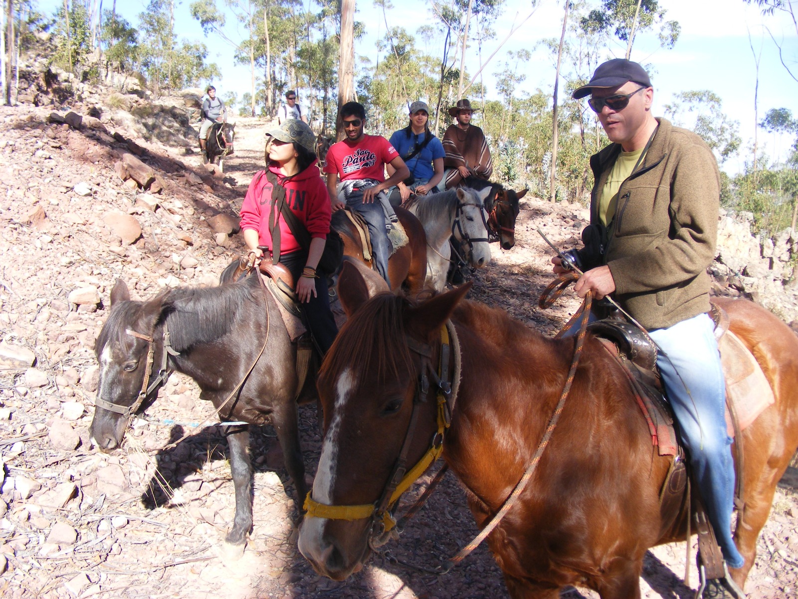 Travelers enjoying a guided horseback riding tour near Sucre, Bolivia