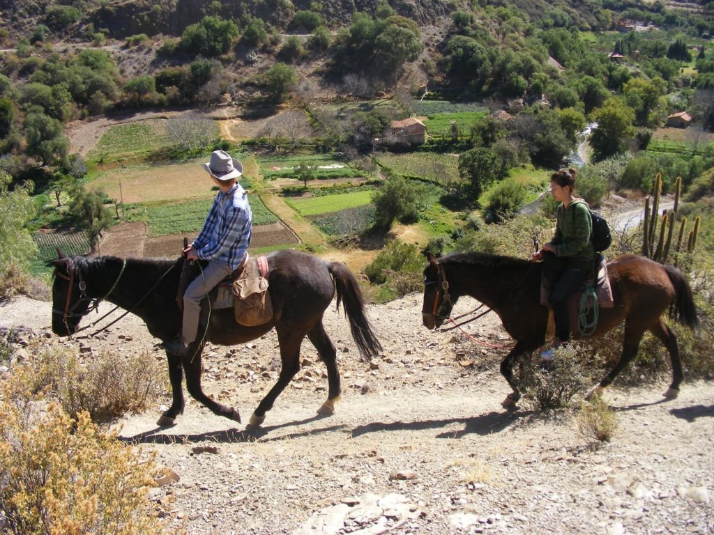 Horseback riding tour near Sucre Bolivia through scenic mountain trails