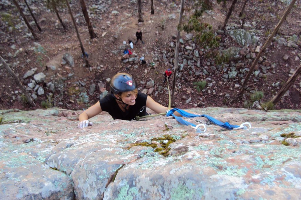 Rock climber ascending a natural wall near Sucre Bolivia