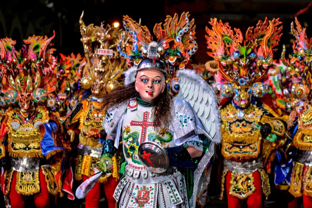Angel and Diablada dancers at the Oruro Carnival in Bolivia