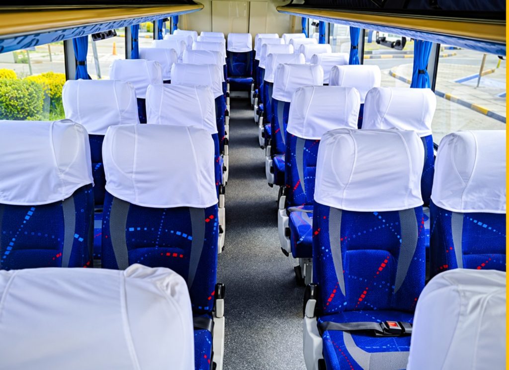 Interior seating of the chartered tourist bus for the Silver Oruro Carnival package